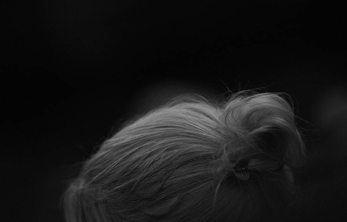 Close-up of shoulder-length brunette hair with subtle hair lowlights adding depth around the face