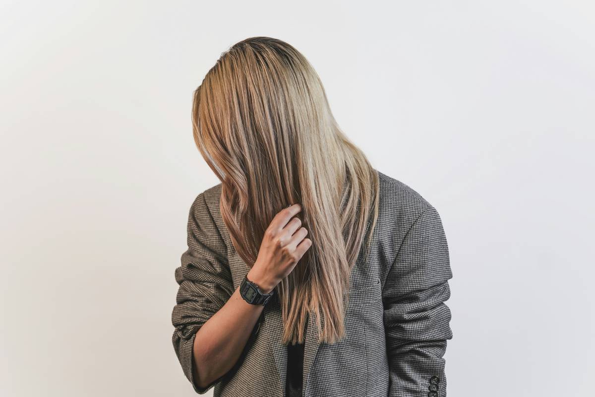 Close-up of dimensional brunette hair showing seamless lowlight hair expertise for natural depth